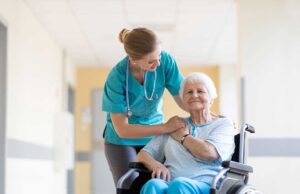 An older adult using a touchscreen tablet to video call family in a comfortable living space.